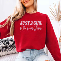 Just A Girl Who Loves Jesus sweatshirt with soft fabric, relaxed fit, and faith-based women’s design.