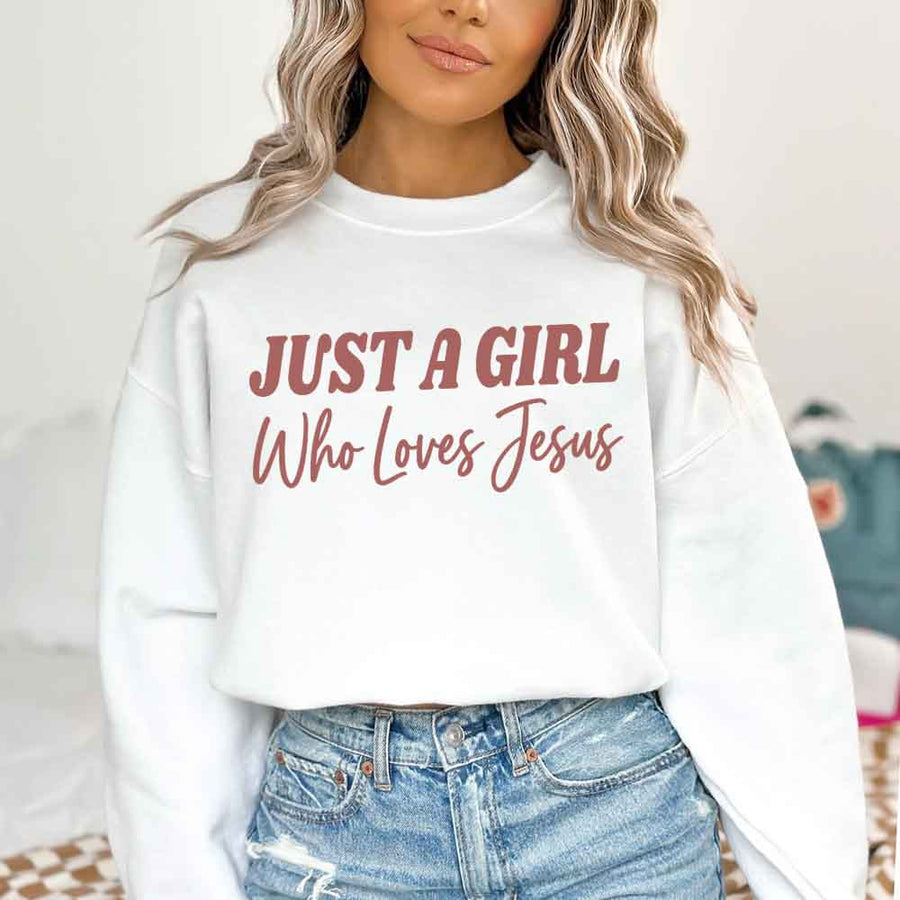 Just A Girl Who Loves Jesus sweatshirt with soft fabric, relaxed fit, and faith-based women’s design.