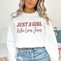 Just A Girl Who Loves Jesus sweatshirt with soft fabric, relaxed fit, and faith-based women’s design.