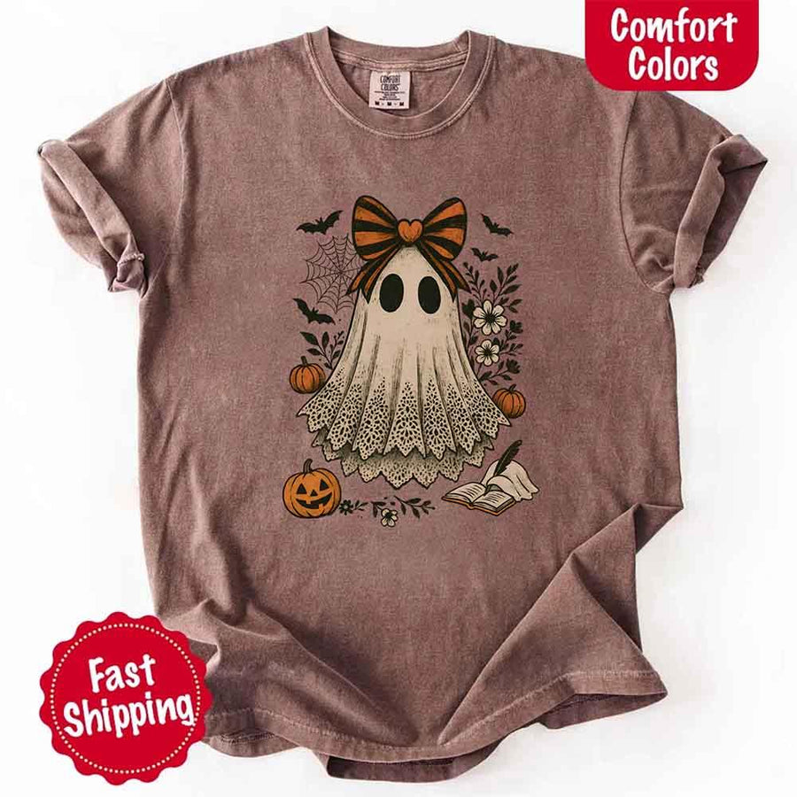 May include lace ghost Halloween graphic with black eyes, orange striped bow, pumpkins, spider web, bats, flowers, and open spell book – spooky vintage shirt design.