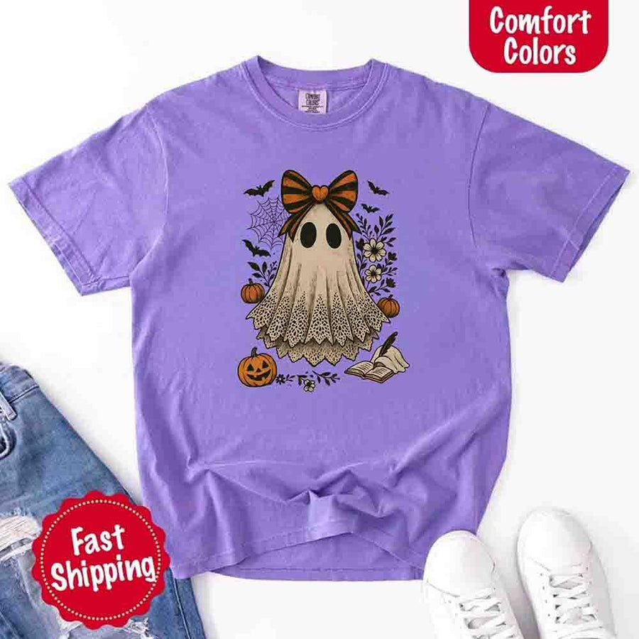 May include lace ghost Halloween graphic with black eyes, orange striped bow, pumpkins, spider web, bats, flowers, and open spell book – spooky vintage shirt design.