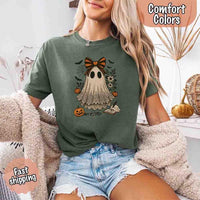 May include lace ghost Halloween graphic with black eyes, orange striped bow, pumpkins, spider web, bats, flowers, and open spell book – spooky vintage shirt design.