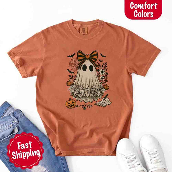 May include lace ghost Halloween graphic with black eyes, orange striped bow, pumpkins, spider web, bats, flowers, and open spell book – spooky vintage shirt design.
