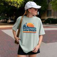 May include a Lake Ontario Comfort Colors T-Shirt featuring a lakeside-inspired graphic design for casual everyday wear.