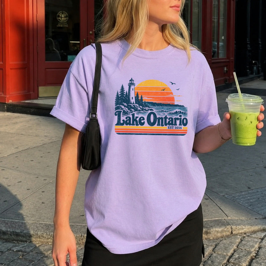 May include a Lake Ontario Comfort Colors T-Shirt featuring a lakeside-inspired graphic design for casual everyday wear.