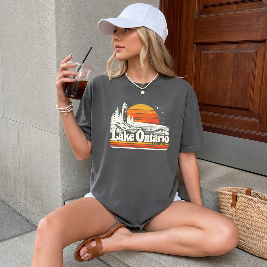 May include a Lake Ontario Comfort Colors T-Shirt featuring a lakeside-inspired graphic design for casual everyday wear.