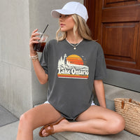 May include a Lake Ontario Comfort Colors T-Shirt featuring a lakeside-inspired graphic design for casual everyday wear.