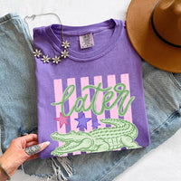 May include a Later Alligator Comfort Colors Tee featuring a playful alligator-inspired statement design on a casual short-sleeve shirt.
