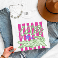May include a Later Alligator Comfort Colors Tee featuring a playful alligator-inspired statement design on a casual short-sleeve shirt.