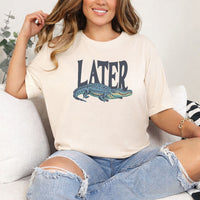 May include Later Gator Vintage 90s unisex t-shirt with retro alligator graphic, classic crew neck, and soft cotton fabric