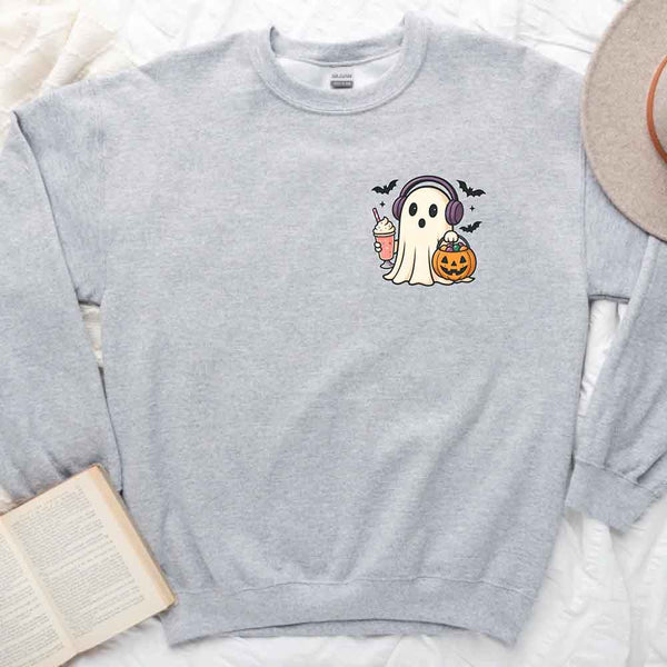 May include cute ghost wearing headphones, holding a milkshake and jack-o’-lantern candy bucket, with flying bats – fun kawaii Halloween graphic tee design.