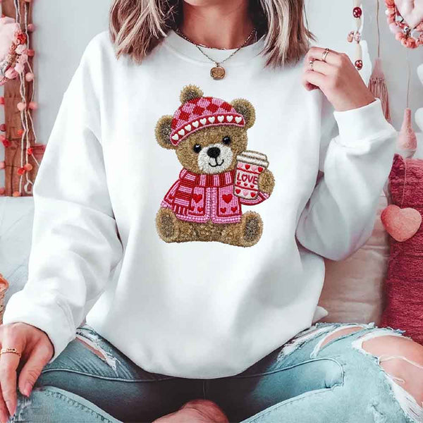 May include a crewneck sweatshirt with a Love Coffee Teddy Valentine design featuring a furry-look 3D printed effect.