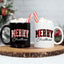 May include a ceramic mug with a buffalo plaid “Merry Christmas” design in traditional red and black tones.