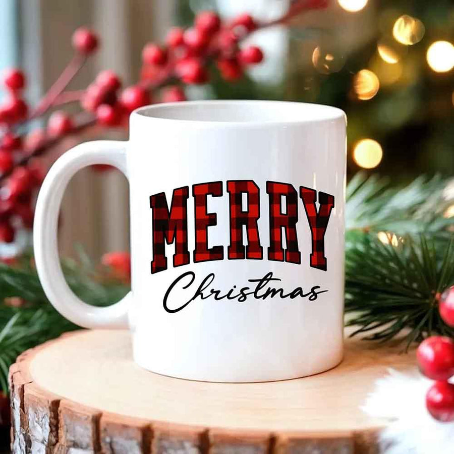 May include a ceramic mug with a buffalo plaid “Merry Christmas” design in traditional red and black tones.