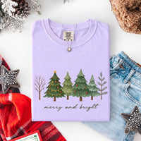 May include a Merry & Bright Christmas tree design on a Comfort Colors T-shirt, featuring a festive holiday theme perfect for Christmas gatherings, seasonal outfits, family celebrations, and gift giving.