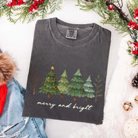 May include a Merry & Bright Christmas tree design on a Comfort Colors T-shirt, featuring a festive holiday theme perfect for Christmas gatherings, seasonal outfits, family celebrations, and gift giving.