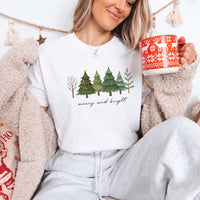 May include a Merry & Bright Christmas tree design on a Comfort Colors T-shirt, featuring a festive holiday theme perfect for Christmas gatherings, seasonal outfits, family celebrations, and gift giving.