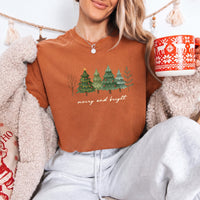 May include a Merry & Bright Christmas tree design on a Comfort Colors T-shirt, featuring a festive holiday theme perfect for Christmas gatherings, seasonal outfits, family celebrations, and gift giving.