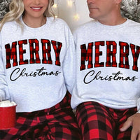 May include a close view of the words “Merry Christmas” printed on fabric, with the top word in a red and black buffalo plaid pattern and the script below in clean black lettering.