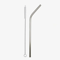 Bent stainless steel straw with cleaning brush on white background