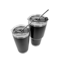 Two black stainless steel tumblers with clear lids and reusable metal straws