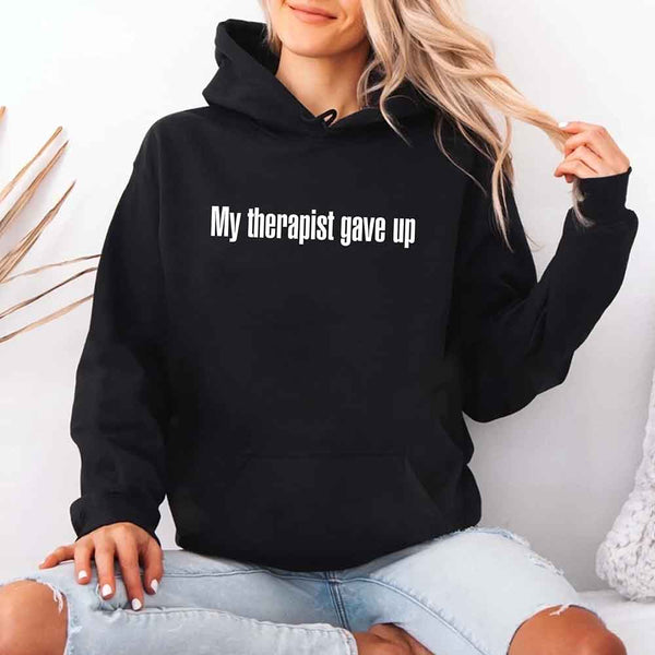 May include a soft fleece hoodie with the humorous phrase “My Therapist Gave Up” printed on the front.