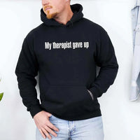 May include a soft fleece hoodie with the humorous phrase “My Therapist Gave Up” printed on the front.