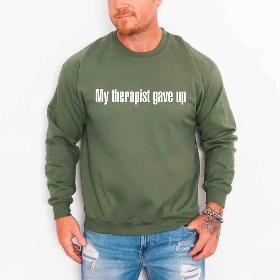 May include a crew neck sweatshirt with the humorous phrase “My Therapist Gave Up” printed on the front.