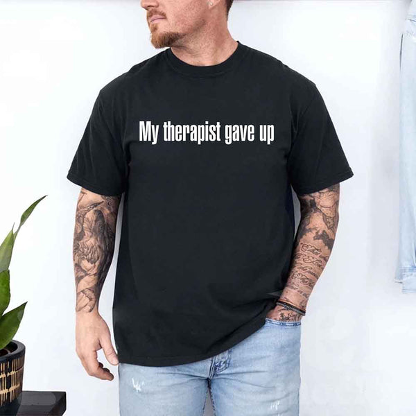 May include a unisex T-shirt with the text “My Therapist Gave Up” printed in a simple, bold style on the front.