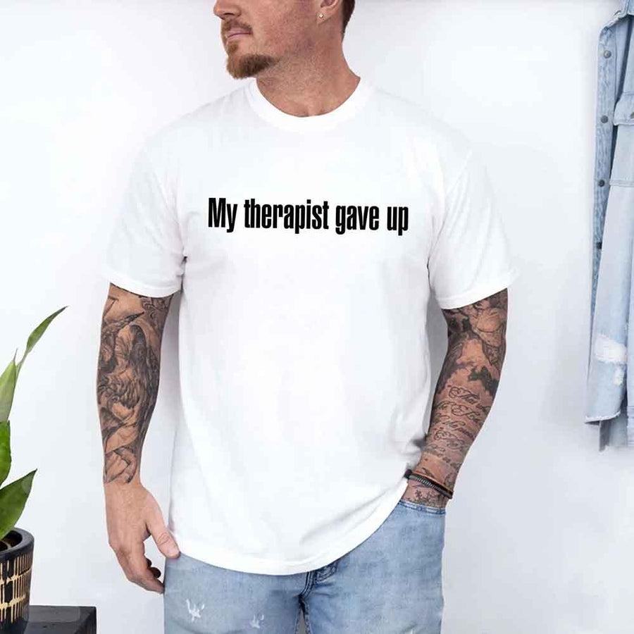 May include a unisex T-shirt with the text “My Therapist Gave Up” printed in a simple, bold style on the front.