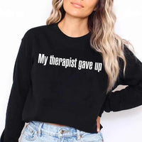 May include a long sleeve t-shirt with the phrase “My Therapist Gave Up” printed across the front.