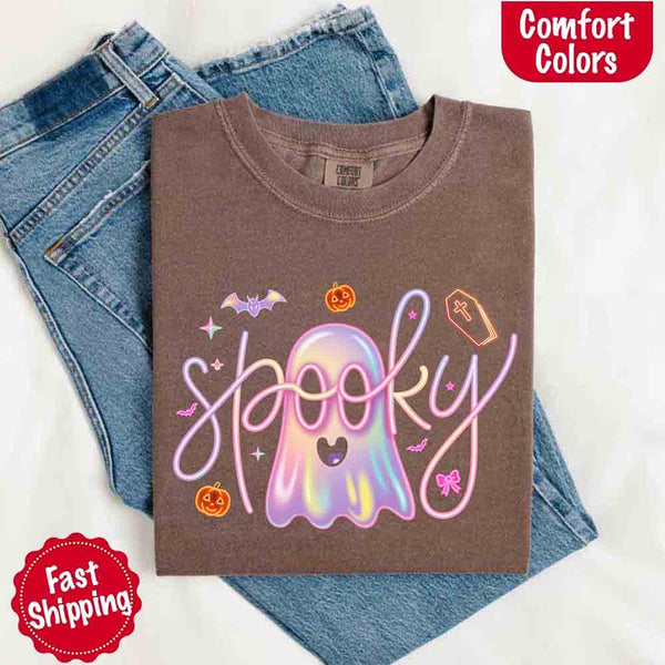 May include holographic ghost with happy face, pastel neon spooky text, pumpkins, bats, coffin, bow, and stars – trendy Halloween graphic tee design.