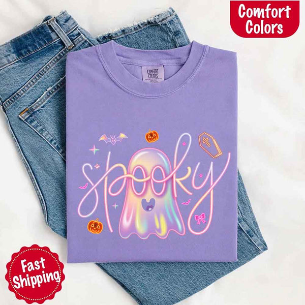 May include holographic ghost with happy face, pastel neon spooky text, pumpkins, bats, coffin, bow, and stars – trendy Halloween graphic tee design.
