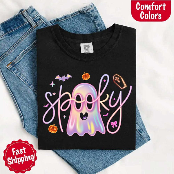 May include holographic ghost with happy face, pastel neon spooky text, pumpkins, bats, coffin, bow, and stars – trendy Halloween graphic tee design.