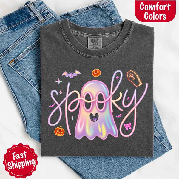 May include holographic ghost with happy face, pastel neon spooky text, pumpkins, bats, coffin, bow, and stars – trendy Halloween graphic tee design.