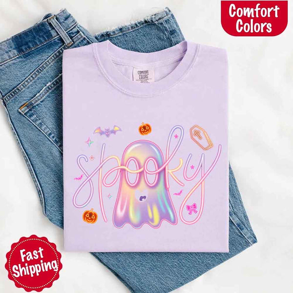 May include holographic ghost with happy face, pastel neon spooky text, pumpkins, bats, coffin, bow, and stars – trendy Halloween graphic tee design.