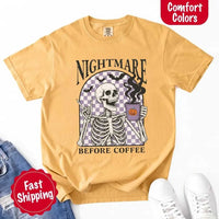 Nightmare Before Coffee skeleton graphic tee featuring skeleton holding a pumpkin coffee mug with steam, bats, and checkered background – funny Halloween coffee shirt.