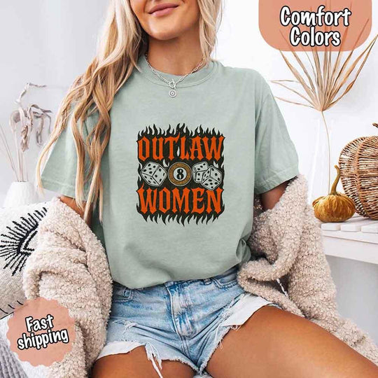 May include a woman wearing a bay Comfort Colors T-shirt with "OUTLAW WOMEN" graphic, paired with denim shorts.