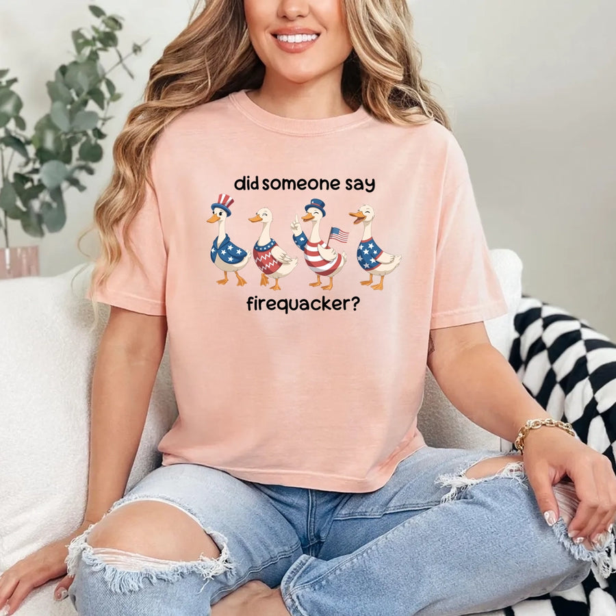 May include a unisex T-shirt with “Firequacker Goose” patriotic 4th of July graphic featuring a funny goose design.