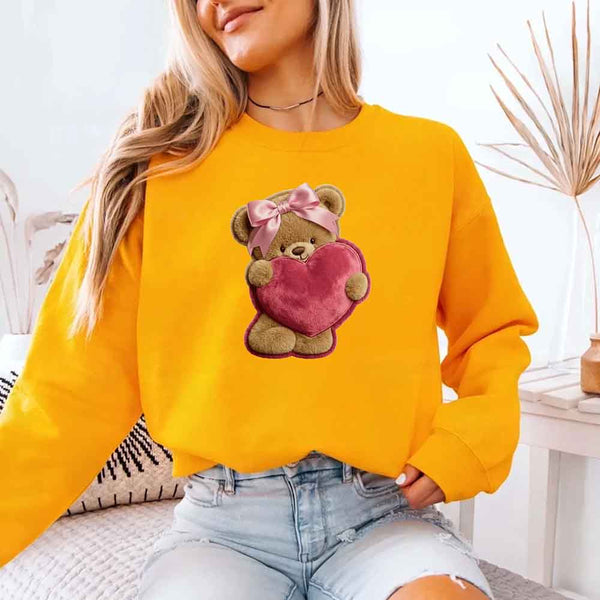 May include a crewneck sweatshirt with a plush teddy Valentine design featuring a furry-look 3D printed effect.