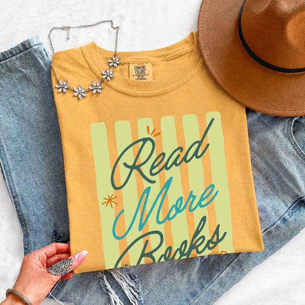 May include Read More Books Comfort Colors t-shirt with book lover graphic, relaxed unisex fit, and garment-dyed cotton
