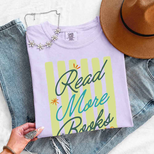 May include Read More Books Comfort Colors t-shirt with book lover graphic, relaxed unisex fit, and garment-dyed cotton