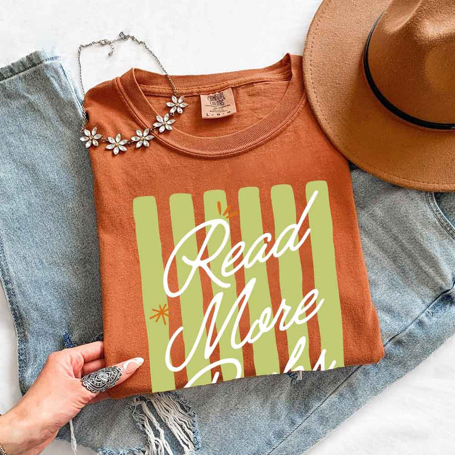 May include Read More Books Comfort Colors t-shirt with book lover graphic, relaxed unisex fit, and garment-dyed cotton