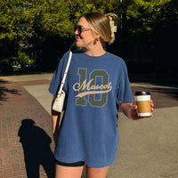 May include a Retro College Football Comfort Colors T-Shirt featuring a vintage-inspired athletic graphic, collegiate lettering, and classic game-day style.