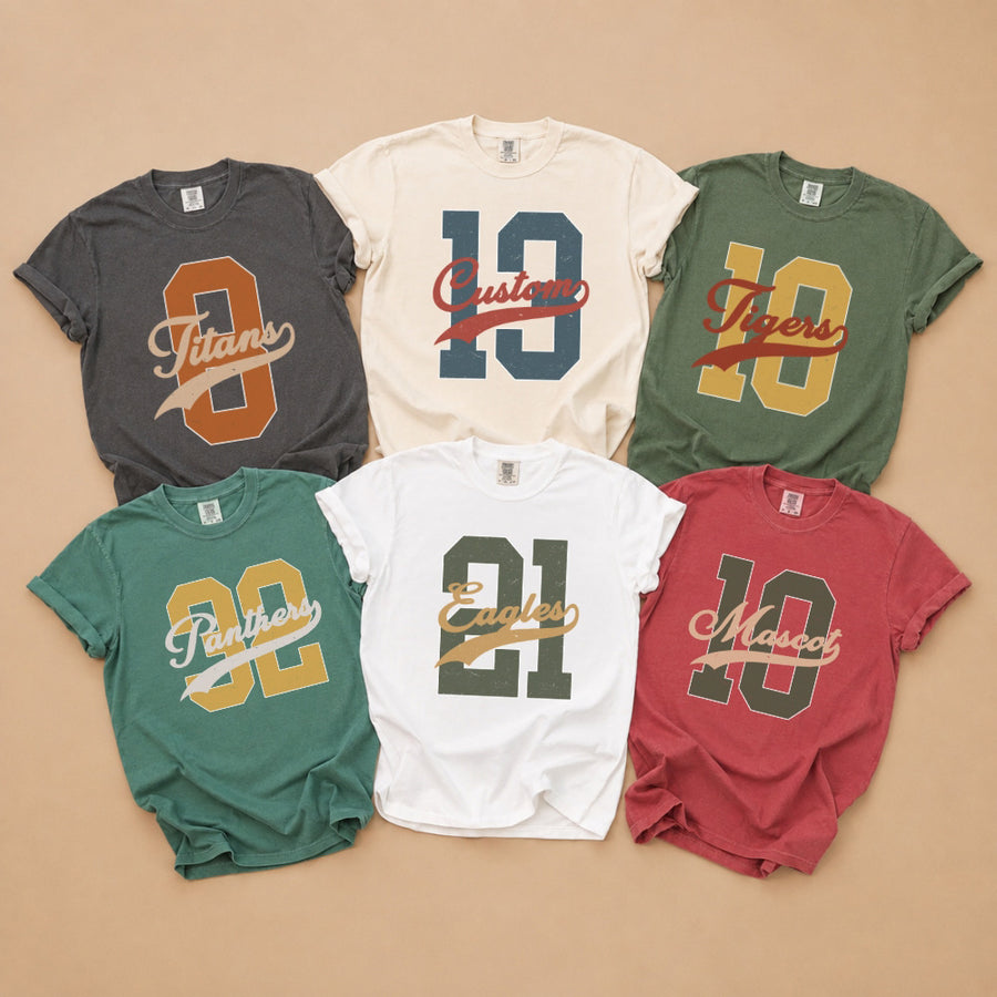 May include a Retro College Football Comfort Colors T-Shirt featuring a vintage-inspired athletic graphic, collegiate lettering, and classic game-day style.
