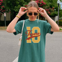 May include a Retro College Football Comfort Colors T-Shirt featuring a vintage-inspired athletic graphic, collegiate lettering, and classic game-day style.