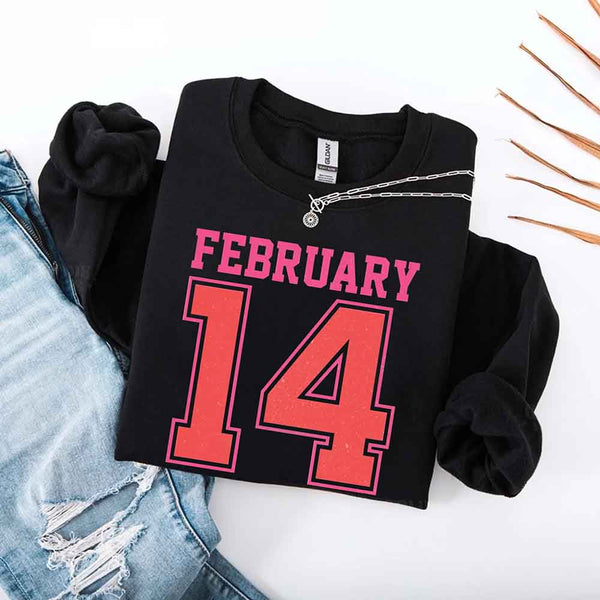 May include a midweight crewneck sweatshirt with a retro FEBRUARY 14 graphic for Valentine’s Day.