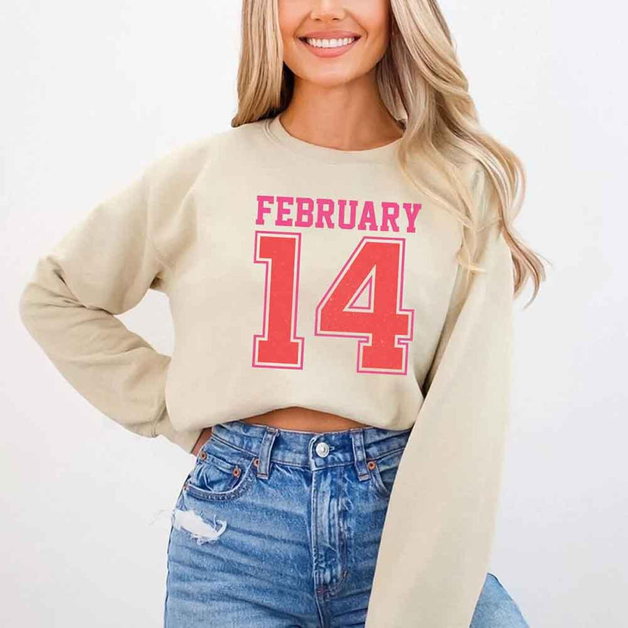 May include a midweight crewneck sweatshirt with a retro FEBRUARY 14 graphic for Valentine’s Day.