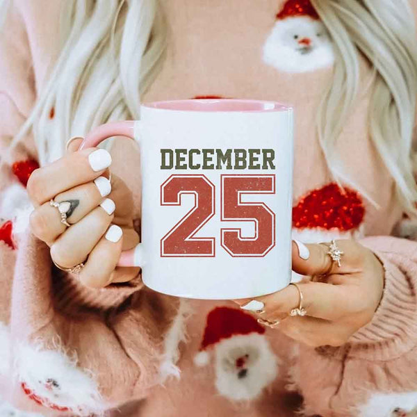 May include a glossy ceramic mug with a retro December 25 Christmas design in traditional holiday colors.