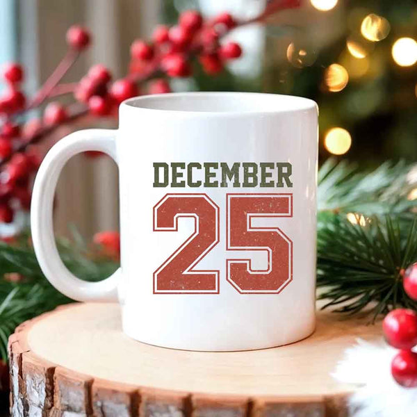 May include a glossy ceramic mug with a retro December 25 Christmas design in traditional holiday colors.